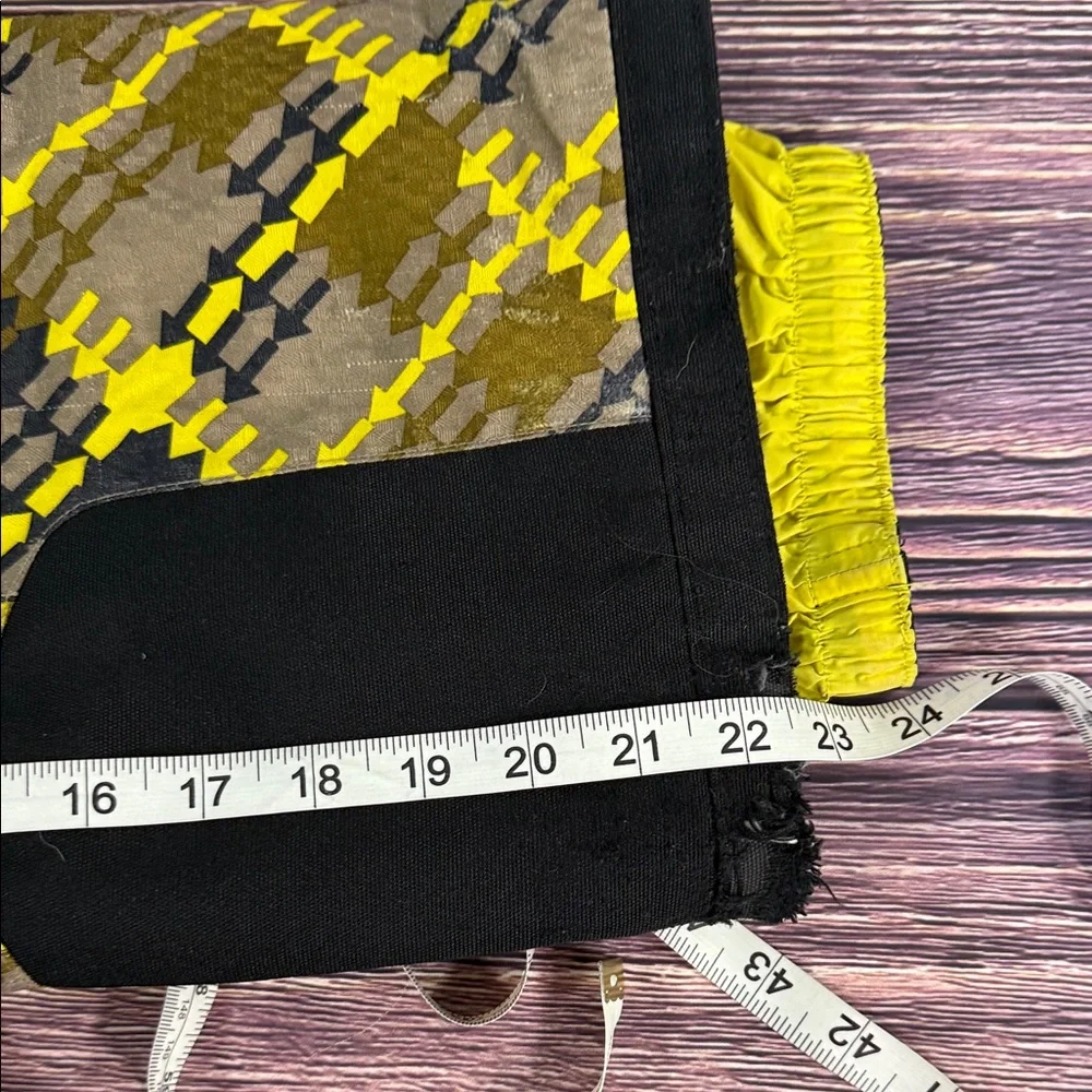 SPYDER Boys' Propulsion ski pants with an olive, black, and yellow plaid pattern